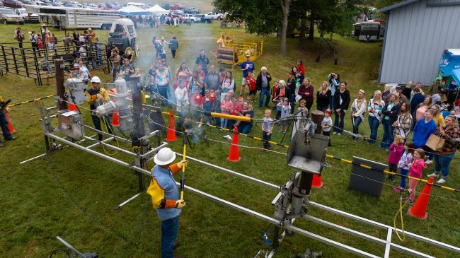 The South Central Indiana line crew gives a live-line demonstration during the Children's Farm Festival at Peden Farm.